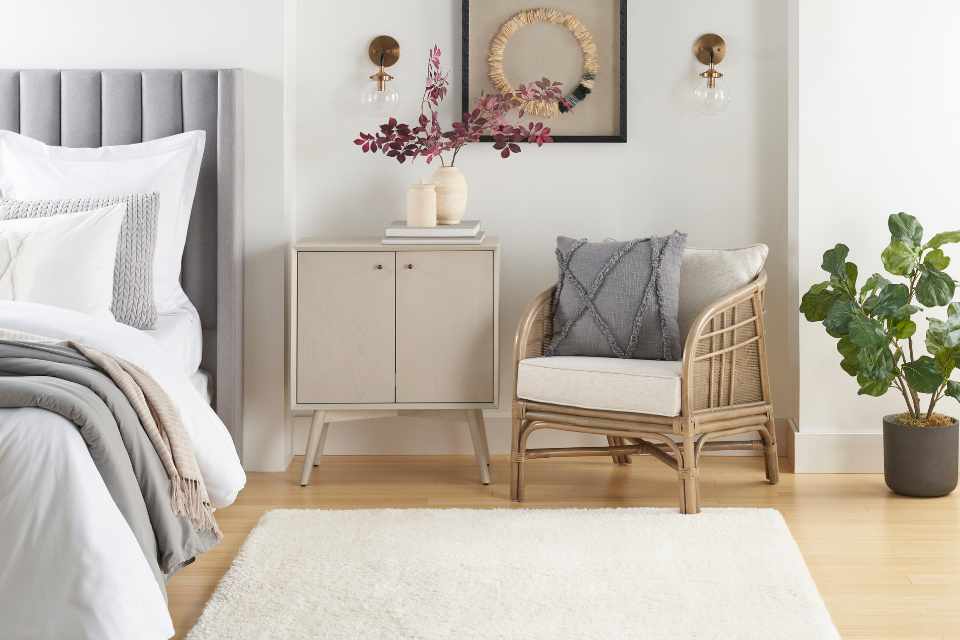 white area rug in modern bedroom with wicker chair